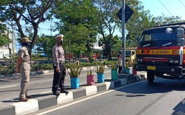 Jaring Enam Pelanggar Prokes di Jembatan Suramadu