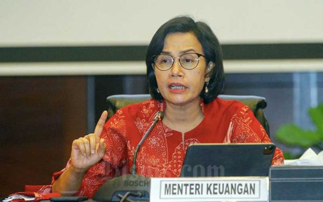 Menteri Keuangan Sri Mulyani Indrawati memberikan pemaparan dalam konferensi pers Realisasi APBN 2021 di Jakarta, Senin (3/1/2021). Bisnis - Himawan L Nugraha